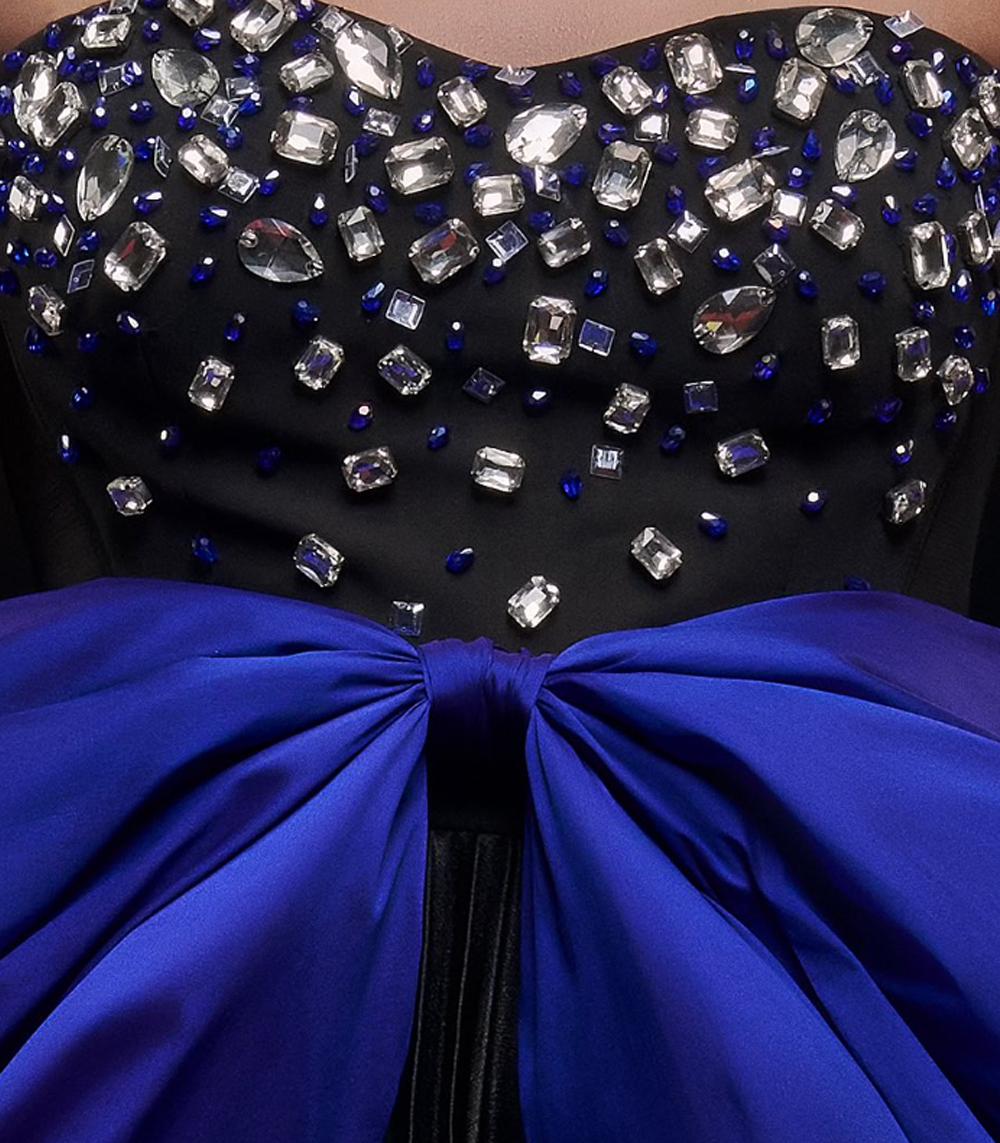 BLACK AND ROYAL BLUE PLEATED JUMPSUIT WITH EXAGGERATED BOW