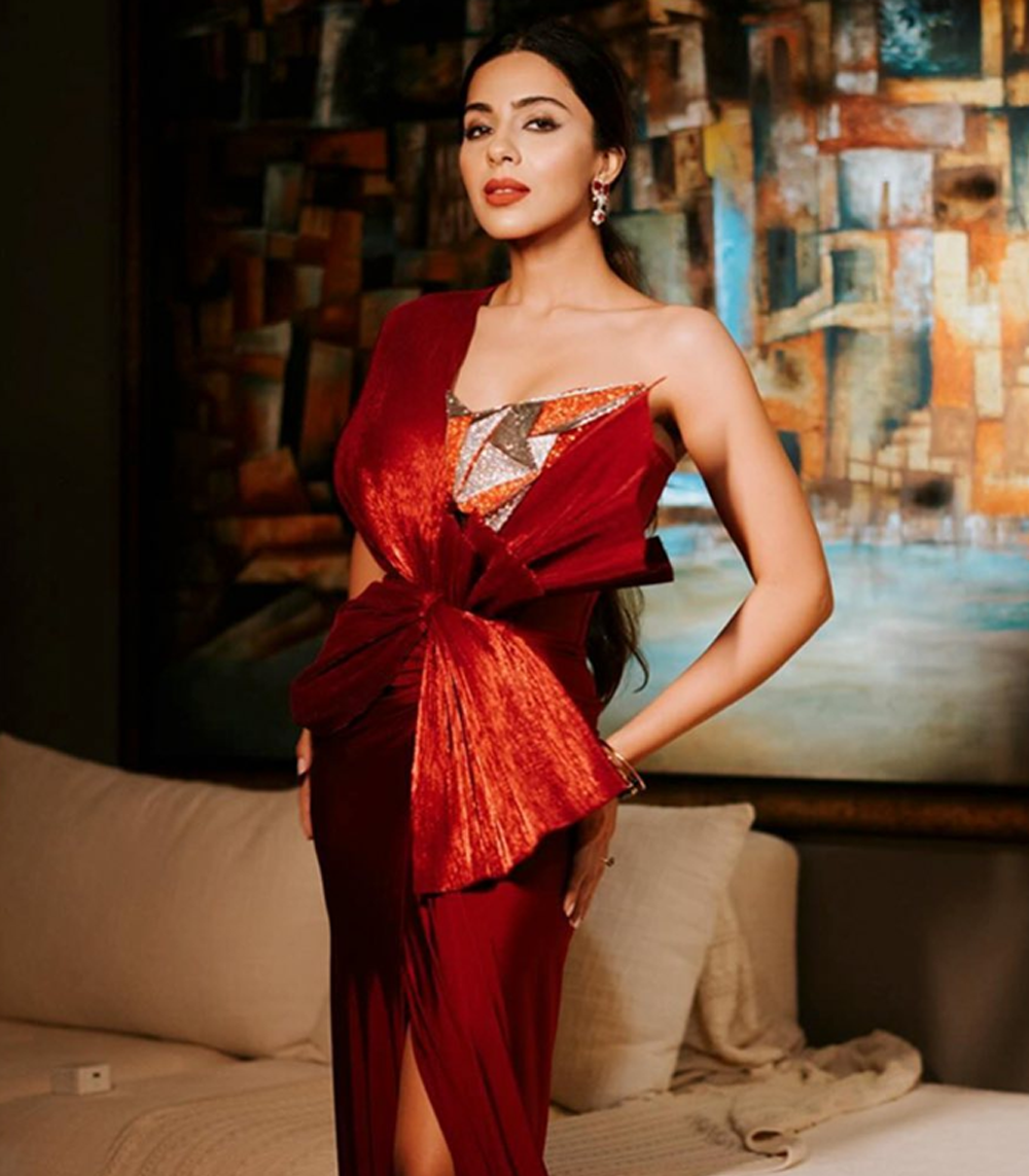 RED PLEATED GOWN WITH DRAPED SKIRT